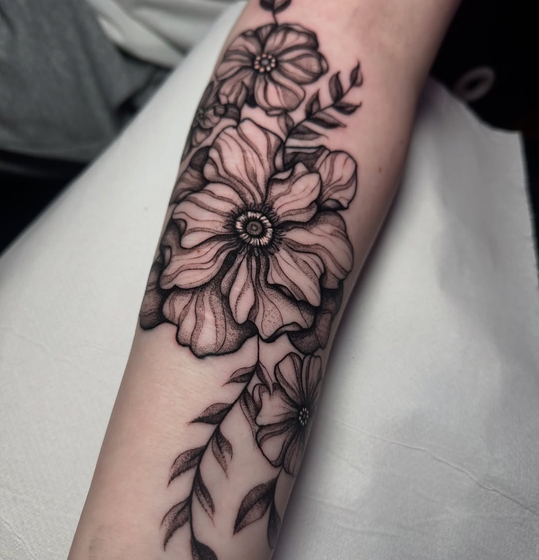 Close up image from this floral scar cover up done by Symone from Ashton Ink Tattoo Studio - tattoo shops tameside